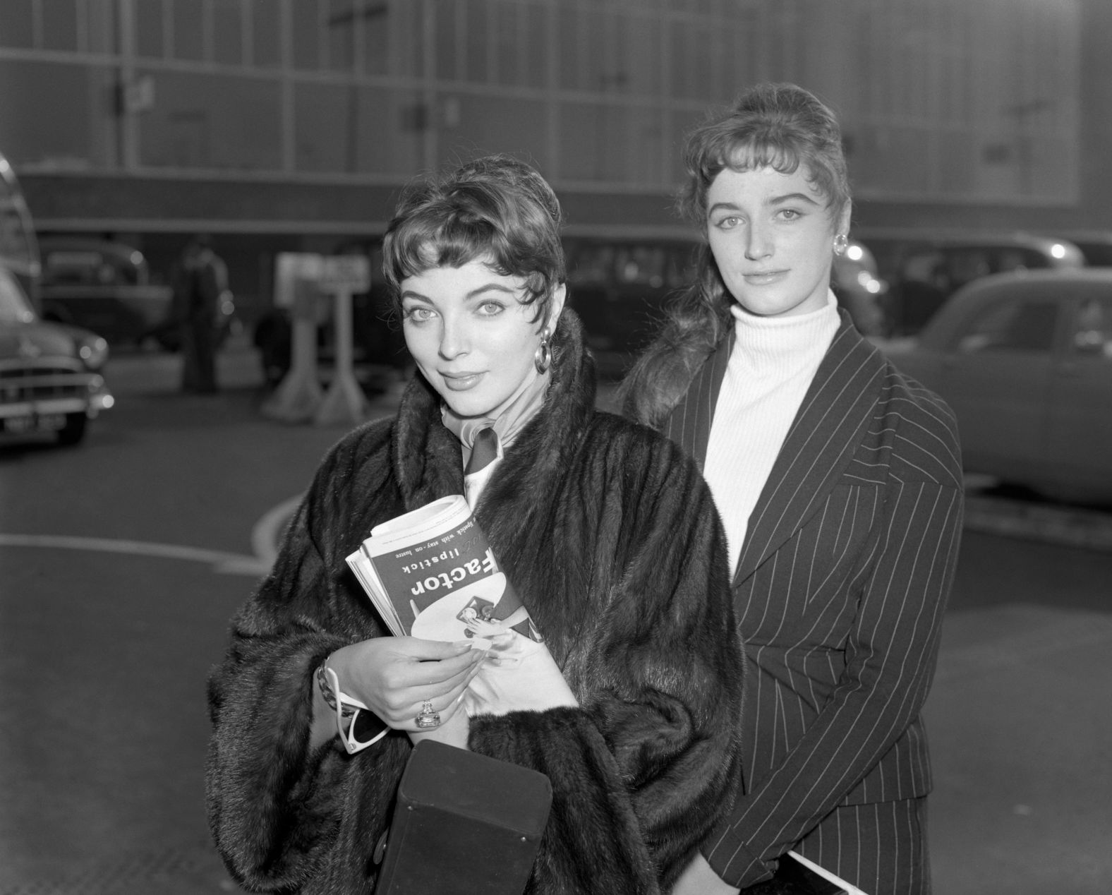 The two sisters, seen here at the London Airport in 1955, had show business in their blood. Their father, Joe Collins, <a href="index.php?page=&url=https%3A%2F%2Fapnews.com%2Farticle%2F024e612dadedf18aa29e7c441ada9d75" target="_blank" target="_blank">was a theatrical agent.</a>