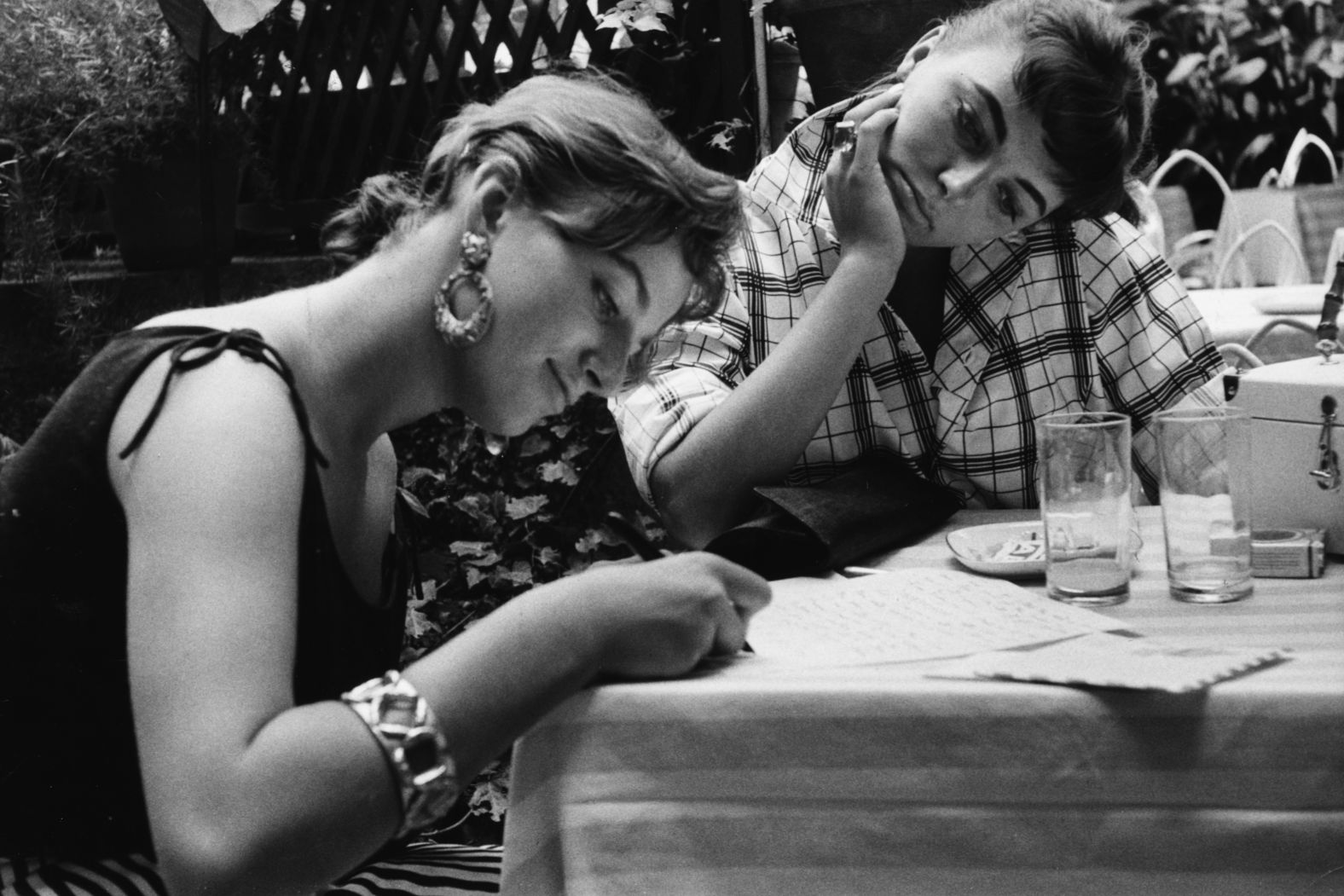Here, Jackie (left) and Joan (right) caught up on correspondence while on location for Joan's film "Land of the Pharaohs" in 1955. "When I started in movies she cut out every single thing that was in the papers, pasted them in scrapbooks," Joan says in <a href="index.php?page=&url=http%3A%2F%2Fwww.cnn.com%2Fshows%2Fcnn-films" target="_blank">CNN Films' "Lady Boss: The Jackie Collins Story."</a> "She was always scribbling away. I never really asked what she was writing but she was certainly writing."