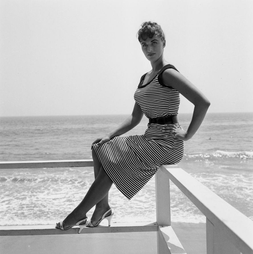 In addition to keeping a record of her sister's career, the future novelist maintained meticulously detailed diaries of her own adventures. Seen here on a Los Angeles beach in 1956, Collins described meeting the likes of Gene Kelly, Judy Garland, Brigitte Bardot and -- perhaps most infamously -- Marlon Brando, with whom she reportedly had a fling. "I spoke to him quite a lot, he's only my height and kind of fat," Collins wrote in her diary, as read in "Lady Boss." "He called me sincere, sweet and luscious."