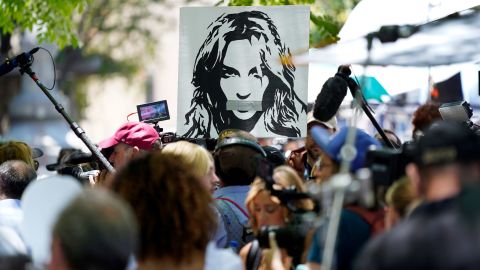 A portrait of Britney Spears looms over supporters and media members outside the court hearing concerning the singer's conservatorship at the Stanley Mosk Courthouse on Wednesday, June 23, in Los Angeles.