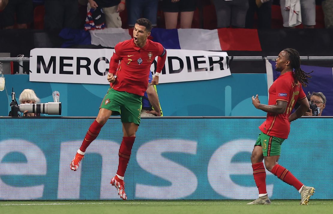 Ronaldo celebrates with teammate Renato Sanches after scoring his side's second goal against France.