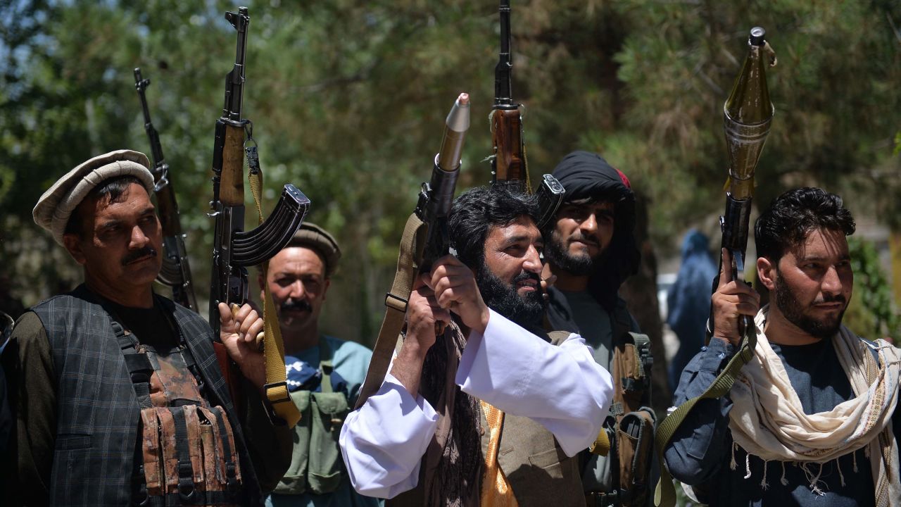 People gather with guns to support Afghanistan security forces against the Taliban, in Guzara district, Herat province on June 23.