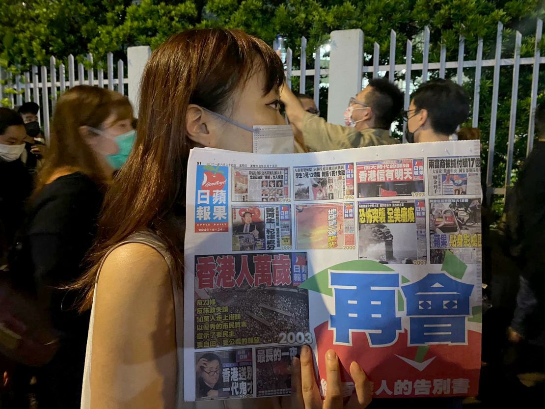 Supporters of pro-democracy newspaper Apple Daily outside the company's office building in Hong Kong.