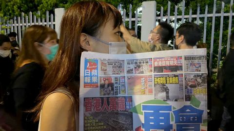 Supporters of pro-democracy newspaper Apple Daily outside the company's office building in Hong Kong.