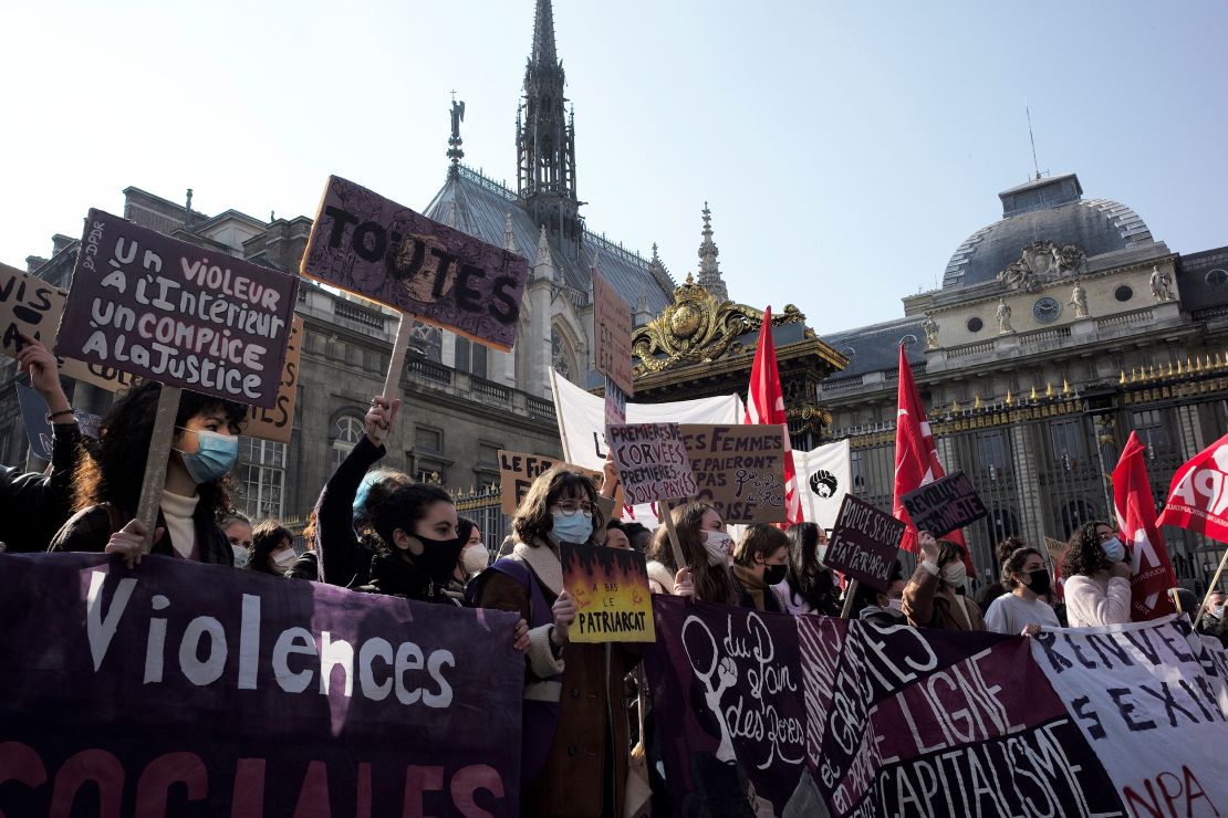 Protesters walk past the Paris courthouse during a demonstration on International Women's Day in March 2021 against violence against women, sexual harassment and femicide in Paris, France.