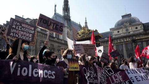 Protesters walk past the Paris courthouse during a demonstration on International Women's Day in March 2021 against violence against women, sexual harassment and femicide in Paris, France.
