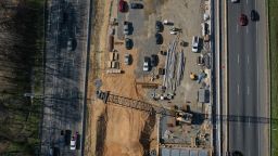 FREDERICKSBURG, VA - APRIL 6: In an aerial view, vehicles on Interstate 95 travel past a construction project to add three lanes to the I-95 Rappahannock River Crossing on April 6, 2021 in Fredericksburg, Virginia. The site of the work is a vital chokepoint for cars and freight trucks moving both north and south along the East Coast. At the end of March, President Joe Biden introduced a $2 trillion plan to overhaul and upgrade the nation's infrastructure. The plan aims to revitalize the U.S. transportation infrastructure, water systems, broadband internet, make investments in manufacturing and job training efforts, and other goals. (Photo by Drew Angerer/Getty Images)