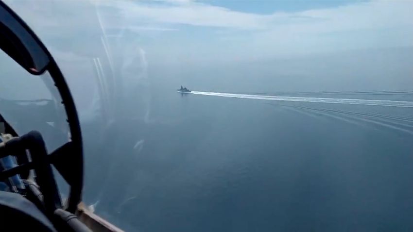 Image of Russian Black Sea Fleet and border patrol boat's prevention of the breach of the Russian state border committed by the UK Navy destroyer Defender on June 24, 2021. The Russian Defence Ministry said a border patrol boat fired the shots at HMS Defender after it entered the country's territorial waters in the Black Sea. It also said that a Su-24M warplane dropped four bombs close to the ship. Britain dismisses Russian claims, saying that the 152 metre-long, 8,500-tonne vessel was conducting innocent passage through Ukrainian territorial waters in accordance with international law. In a statement posted on Twitter, it said: We believe the Russians were undertaking a gunnery exercise in the Black Sea and provided the maritime community with prior warning of their activity. No shots were directed at HMS Defender and we do not recognise the claim that bombs were dropped in her path.<0x0a> (Newscom TagID: eyepress104890.jpg) [Photo via Newscom]