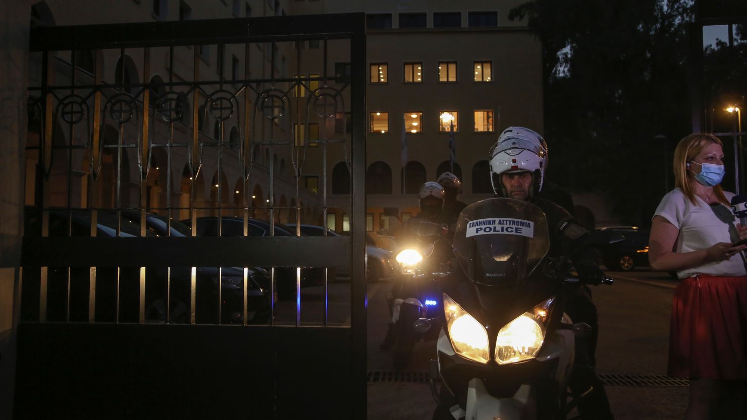 A police officer on a motorcycle leaves the Petraki Monastery in Athens on June 23.