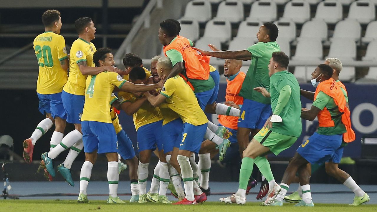 Brazil celebrates Casemiro's winning goal in stoppage time.