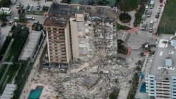 This aerial photo shows part of the 12-story oceanfront Champlain Towers South Condo that collapsed early Thursday, June 24, 2021 in Surfside, Fla.  (Amy Beth Bennett/South Florida Sun-Sentinel via AP)