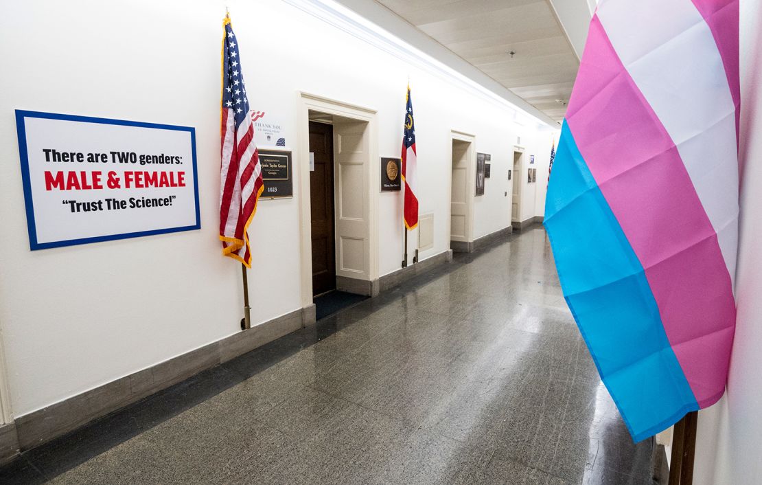  A transphobic sign was put up by Rep. Marjorie Taylor Greene, R-Ga., after Rep. Marie Newman, D-Ill., put up a pro transgener rights flag across the hallway in the Longworth House Office Building. 