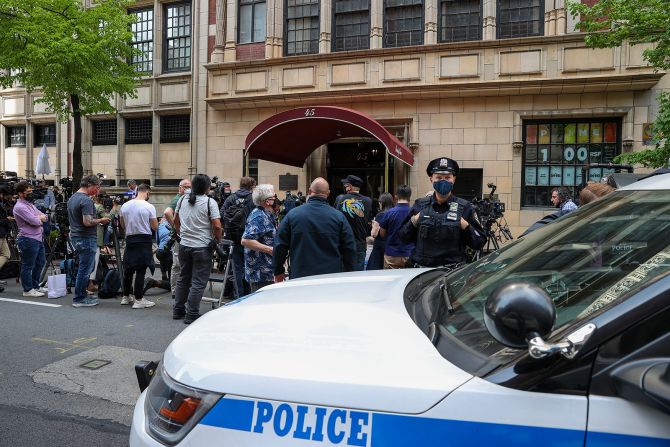 Members of the press gather outside Giuliani's apartment in New York in April 2021. Federal agents <a href="index.php?page=&url=https%3A%2F%2Fwww.cnn.com%2F2021%2F04%2F28%2Fpolitics%2Frudy-giuliani-federal-prosecutors%2Findex.html" target="_blank">executed search warrants</a> at Giuliani's apartment and office, his attorney said, advancing a criminal investigation by federal prosecutors that has been underway for more than two years. Giuliani has been the focus of an investigation concerning his activities in Ukraine, including whether he conducted illegal lobbying for Ukrainian officials while he pursued an investigation linked to Trump's primary political rival, President Joe Biden, CNN has reported. Giuliani hasn't been charged, and he has denied wrongdoing.