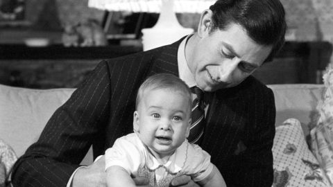 Prince Charles cradles his son Prince William at Kensington Palace in 1982.