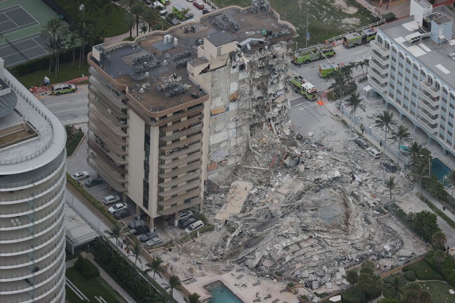 The partial collapse left huge piles of rubble and materials dangling from what remained of the structure.