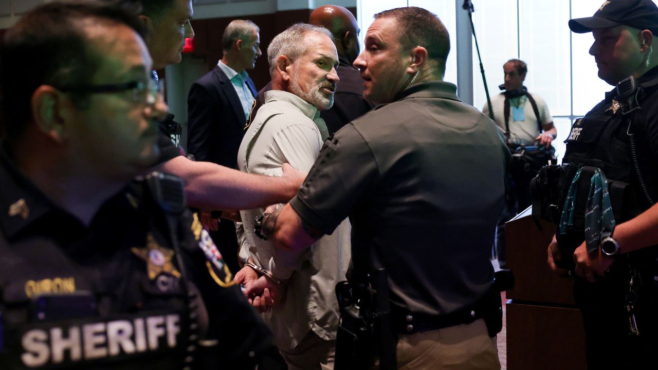 Jon Tigges is detained following a controversial Loudoun County School Board meeting in Ashburn, Virginia on Tuesday.