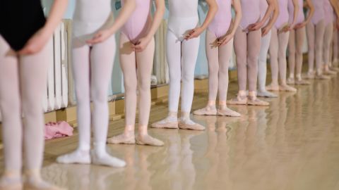 Girls line up in pink tights for a ballet class. Can't we make room on the floor for boys who love to dance?