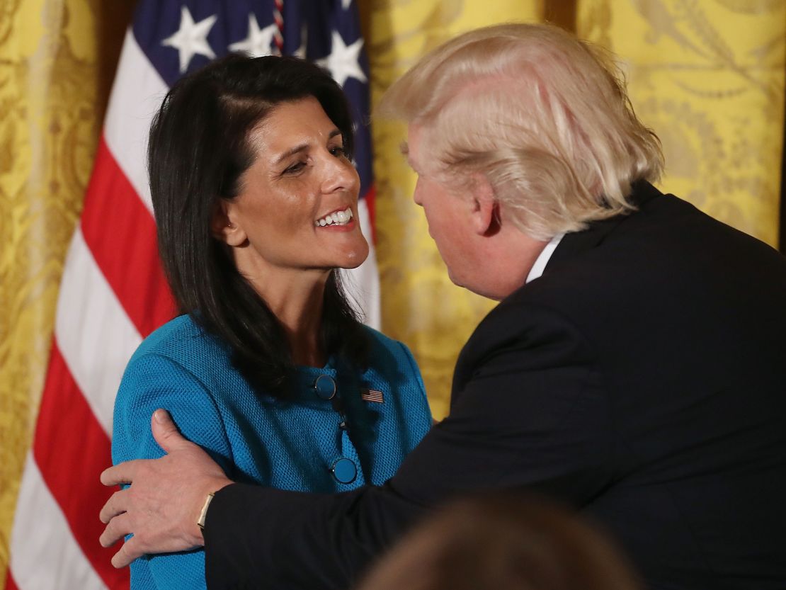 Then-President Donald Trump greets UN Ambassador Nikki Haley during an event celebrating Women's History Month at the White House in 2017. 