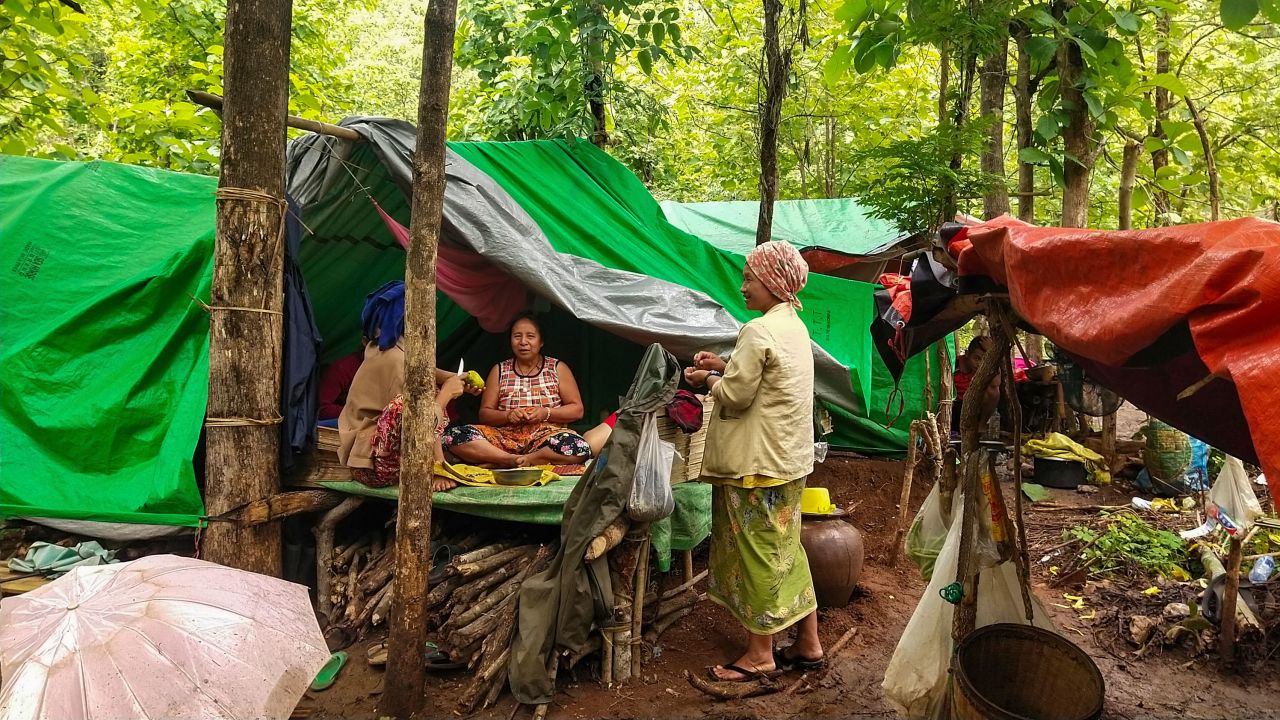 Internally displaced women talk at their makeshift tents at Pu Phar Village, Demawso Township, Kayah state on June 17.