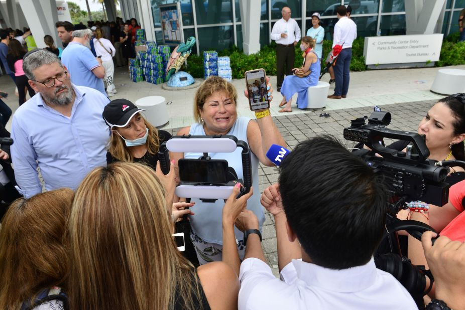 Yube Pettingill talks to the media. Two of her family members were still missing.