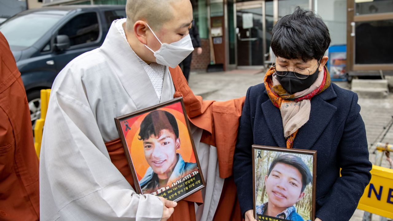 A South Korean monk comforts Myanmar national who cries in front of the Myanmar Embassy on February 25, 2021 in Seoul, South Korea during protests against the military coup in Myanmar.