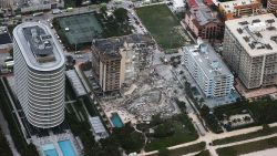 SURFSIDE, FLORIDA - JUNE 24:  In this aerial view, search and rescue personnel work after the partial collapse of the 12-story Champlain Towers South condo building on June 24, 2021 in Surfside, Florida. It is unknown at this time how many people were injured as search-and-rescue effort continues with rescue crews from across Miami-Dade and Broward counties. (Photo by Joe Raedle/Getty Images)