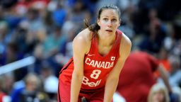 FILE- In this July 29, 2016, file photo, Canada's Kim Gaucher watches during a break in the second half of a women's exhibition basketball game in Bridgeport, Conn. Gaucher say she is being "forced to decide between being a breastfeeding mom or an Olympic athlete." COVID-19 rules prevent her from bringing her daughter, Sophie, who was born in March, to the Tokyo Olympics next month. She says Olympic organizers have said "no friends, no family, no exceptions." The 37-year-old Gaucher is looking into options, such as shipping milk, but has run into complications. (AP Photo/Jessica Hill, File)