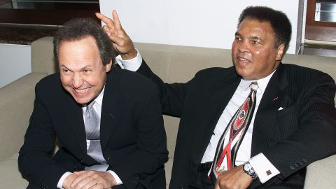 Billy Crystal and Muhammad Ali at Audemars Piguet's Time To Give Celebrity Watch Auction For Charity, held at Christie's Auction House in New York City in 2000.