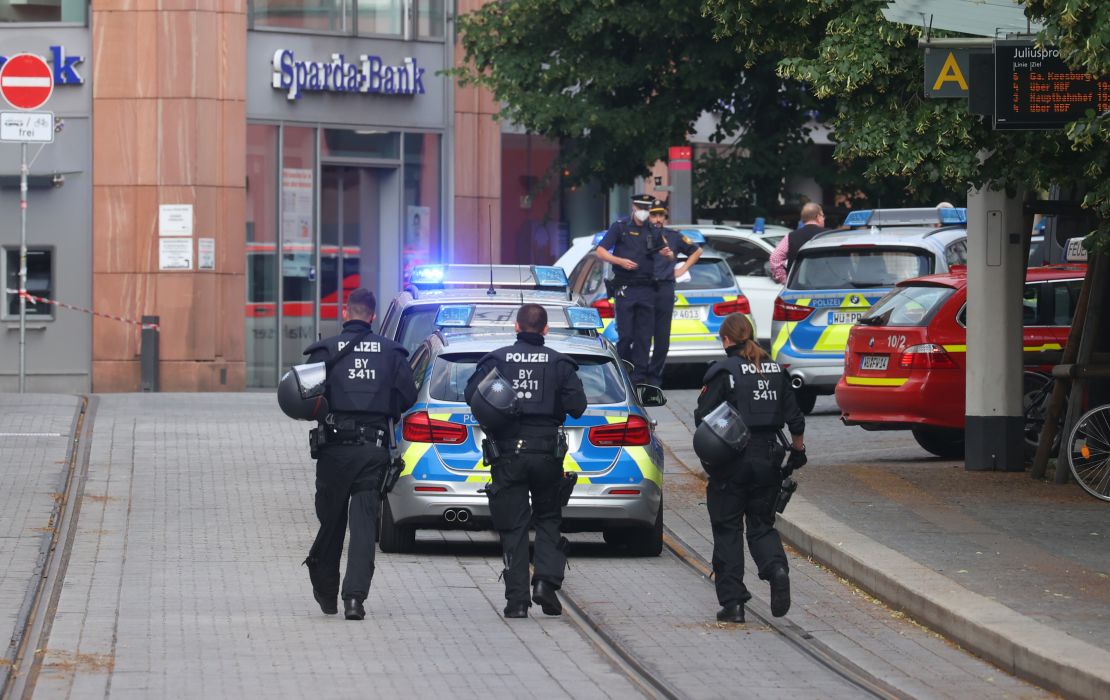 Police officers respond following the attack. 