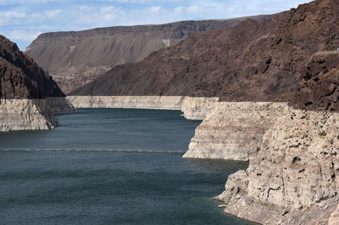 Low water levels can be seen in the Hoover Dam reservoir of Lake Mead on June 9. <a href="index.php?page=&url=https%3A%2F%2Fwww.cnn.com%2F2021%2F05%2F27%2Fweather%2Flake-mead-colorado-river-shortage%2Findex.html" target="_blank">Water levels at Lake Powell and Lake Mead</a> -- the two largest reservoirs on the Colorado River -- have dropped at an alarming rate.
