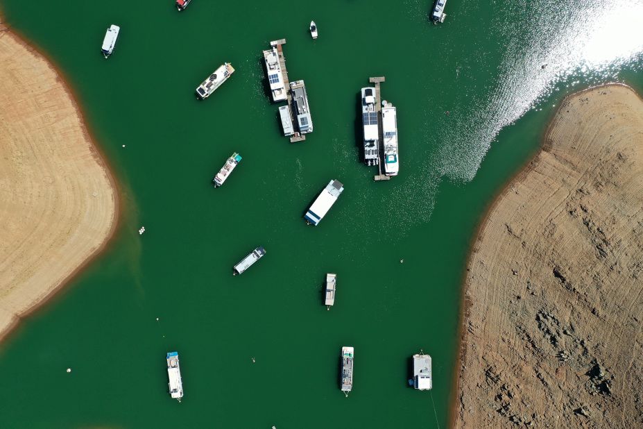 This aerial photo shows houseboats anchored at the Bidwell Canyon Marina in Oroville, California, on June 1. As water levels continued to fall at Lake Oroville, officials were flagging houseboats for removal so they could avoid being stuck or damaged.