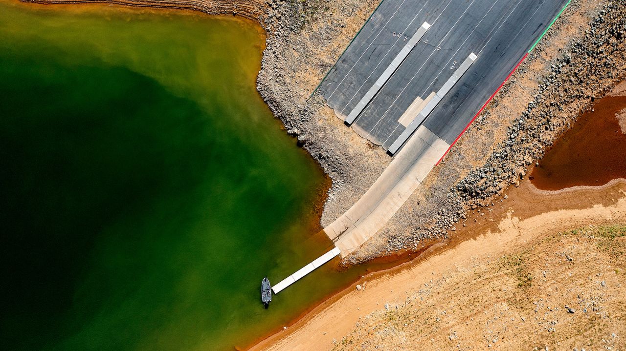 A launch ramp, extended to accommodate low water levels, stretches into California's Lake Oroville on May 22. At the time of this photo, the reservoir was at 39% of capacity and 46% of its historical average.