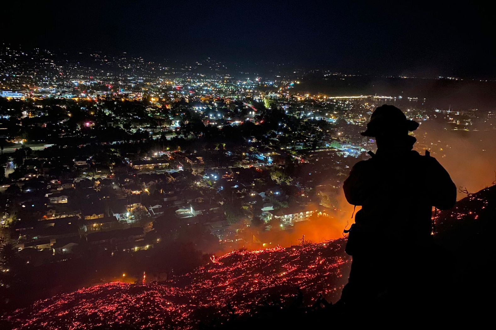 Firefighters battle a brushfire in Santa Barbara, California, in May 2021.