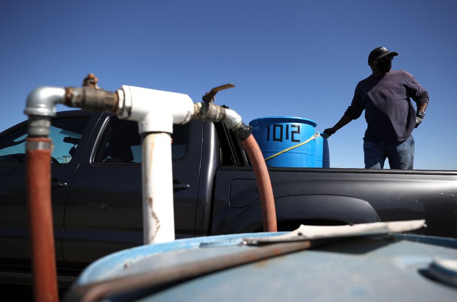 Clinton Jackson prepares to fill water tanks with recycled water in Oakley, California, on May 20. The Ironhouse Sanitation District opened its residential recycled water fill station earlier than usual to make recycled water available for free to Oakley and Bethel Island residents.