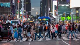 NEW YORK, NEW YORK - JUNE 12: Large crowds of people mostly without masks fill Times Square  on June 12, 2021 in New York City. New York Governor Andrew Cuomo announced pandemic restrictions to be lifted on May 19.  (Photo by Alexi Rosenfeld/Getty Images)