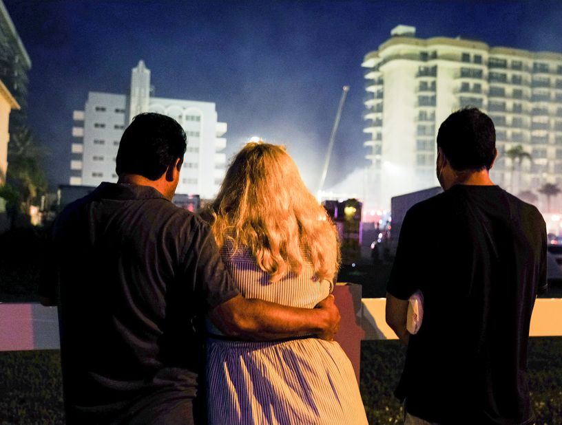 People stand near the building on June 25.