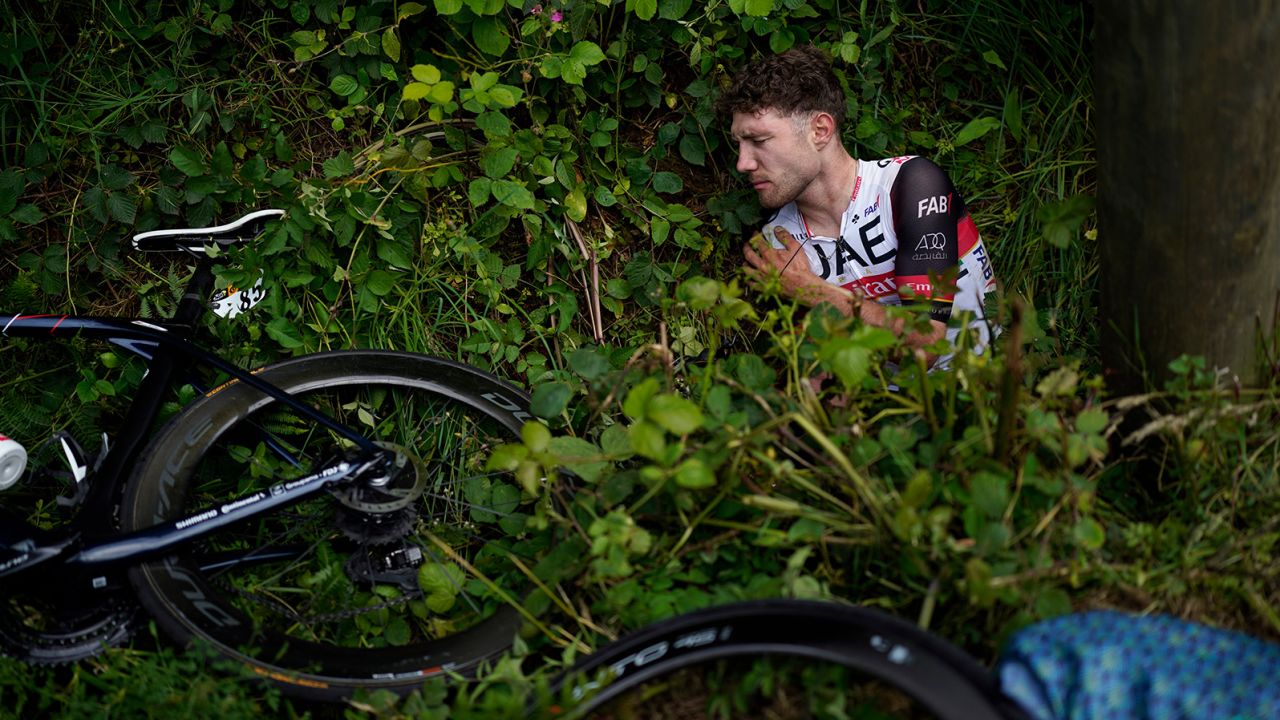 Switzerland's Marc Hirschi lies on the side of the road after crashing during the first stage of the Tour de France.
