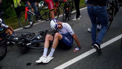 Froome lies on the road after crashing in the second crash of the first stage of the Tour de France.