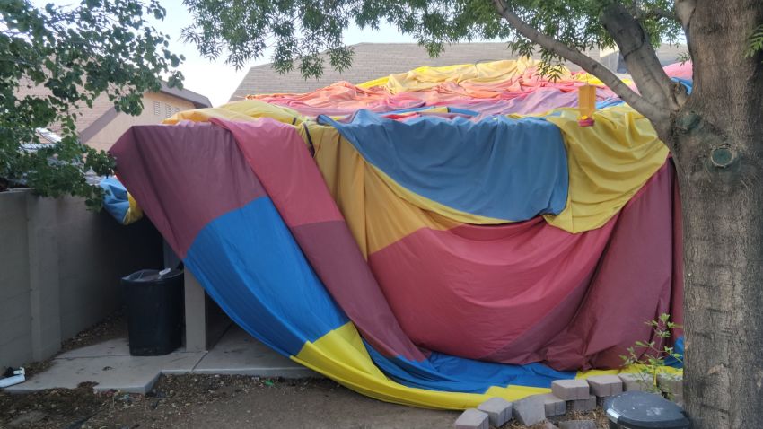Austin Council took this photo of the envelop of a hot air balloon that is covering a neighbor's house in Albuquerque, New Mexico.