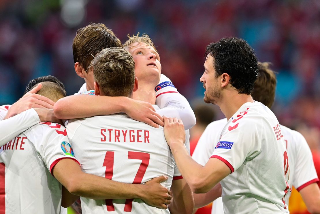 Denmark's Kasper Dolberg celebrates with teammates after scoring against Wales.