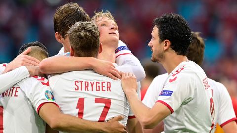 Denmark's Dolberg celebrates with teammates after scoring his side's second goal against Wales.