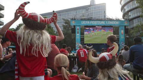 Danish supporters react at a fan area in Potters Field in London.