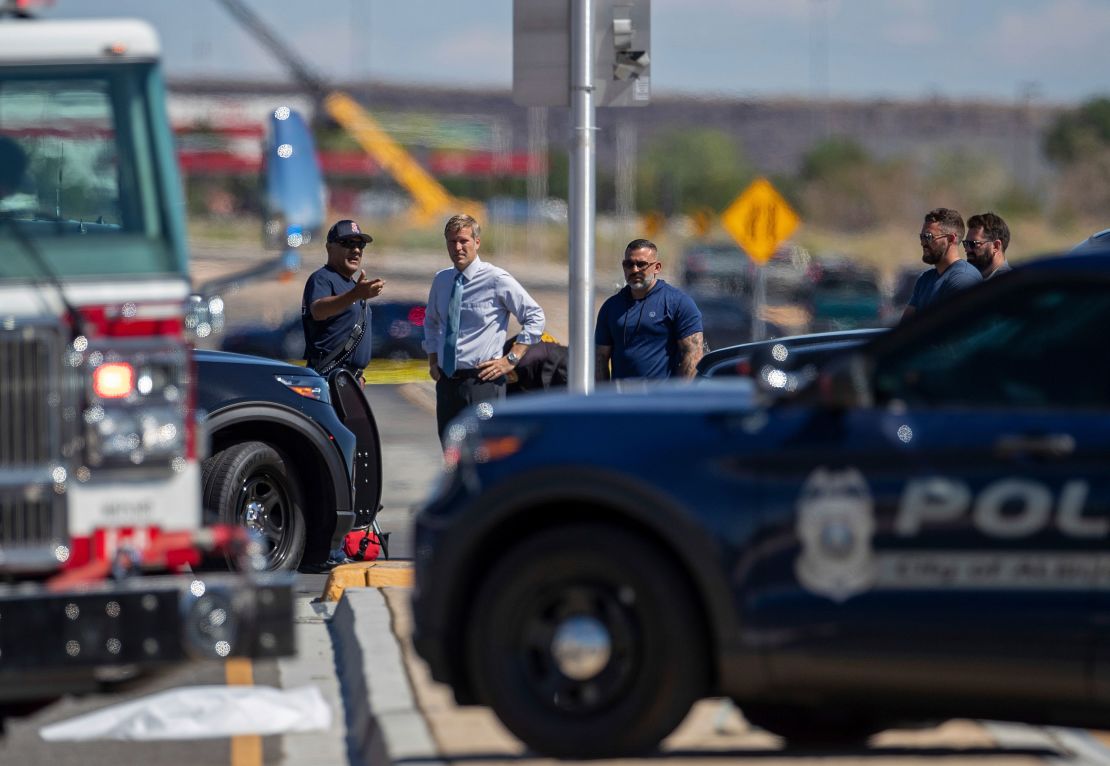 Albuquerque mayor Tim Keller, second from left, is briefed by officials at the site of a fatal balloon crash in Albuquerque.