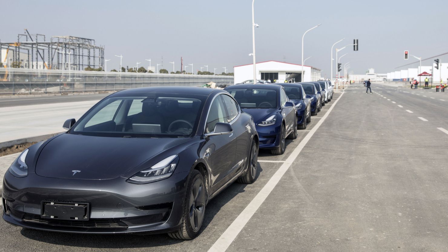 Tesla Model 3 vehicles sit parked at the company's Gigafactory in Shanghai, China, on December 30, 2019.