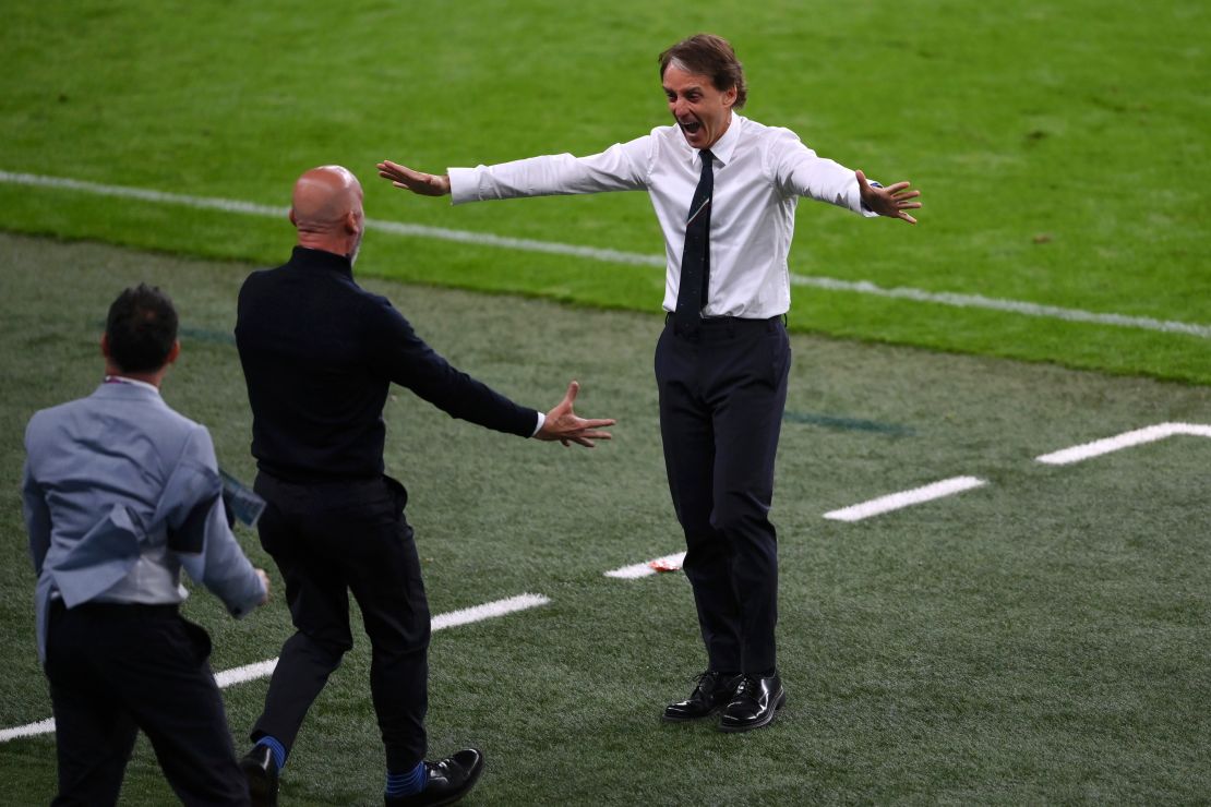 Italy manager Roberto Mancini celebrates after Chiesa scored Italy's goal against Austria.