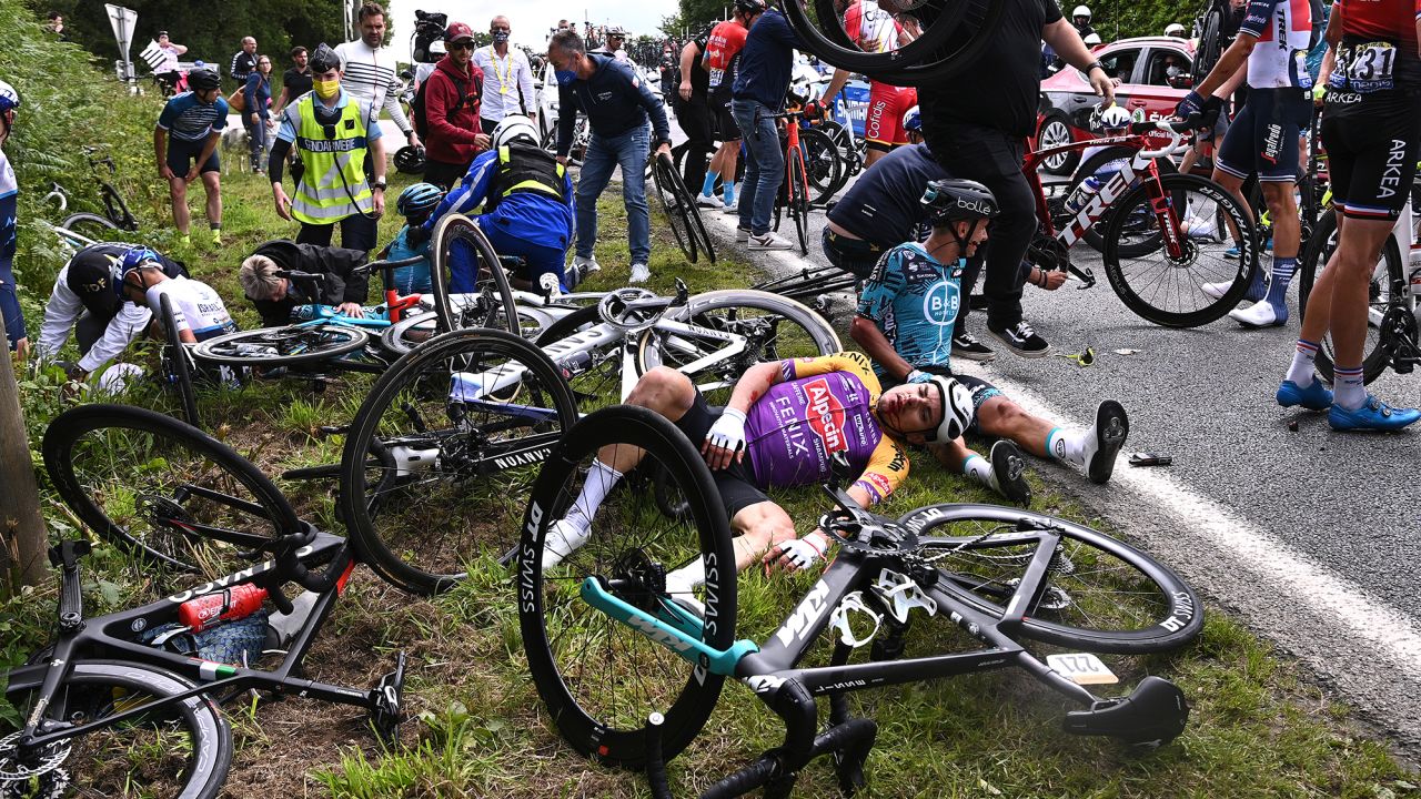 Bryan Coquard of France and Team B&B Hotels p/b KTM & Kristian Sbaragli of Italy and Team Alpecin-Fenix wait for medical assistance after a crash during the 108th Tour de France 2021, Stage 1 a 197,8km stage from Brest to Landerneau.