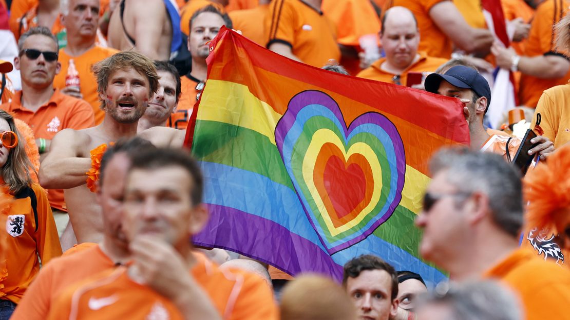 Netherlands supporters hold a rainbow flag during the Euro 2020 match between the Netherlands and the Czech Republic at the Puskas Arena.