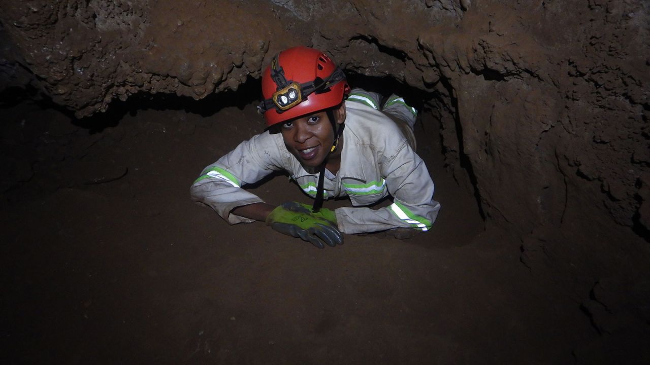 Archaeologist and biological anthropologist Keneiloe Molopyane became a member of the second generation of South Africa's "<a href="https://www.cnn.com/2015/09/10/africa/gallery/naledi-underground-astronauts/index.html" target="_blank">underground astronauts</a>" in 2018 -- tasked with traversing the Rising Star cave system through "very extreme conditions" in order to get to the famed <a href="https://www.cnn.com/2016/05/03/health/gallery/homo-naledi-fossils/index.html" target="_blank">Homo naledi</a> fossil site. She is seen here en route to the Dinaledi Chamber coming out of Superman's Crawl, a passage less than 25 centimeters in height.