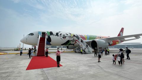 Passengers prepare to board an airplane at Chengdu Tianfu International Airport on June 27. 