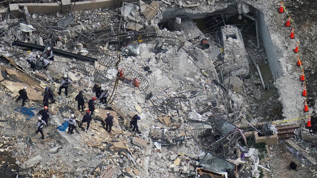 Workers scour the remains of Champlain Towers South after 55 condo units collapsed.